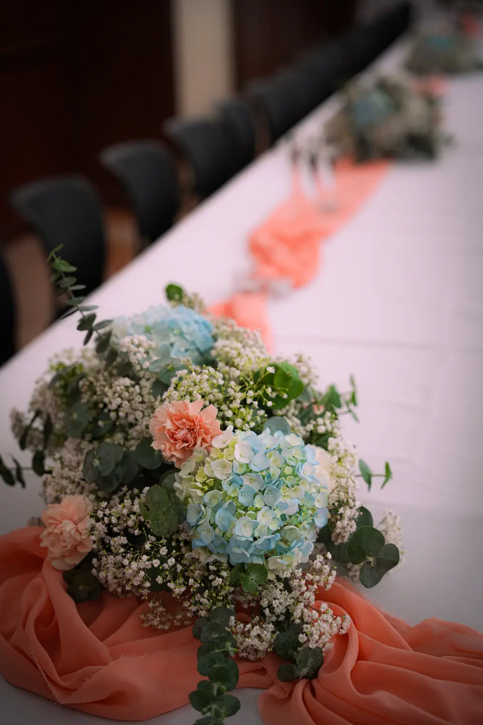 Pastel hydrangeas and carnations arranged for the reception