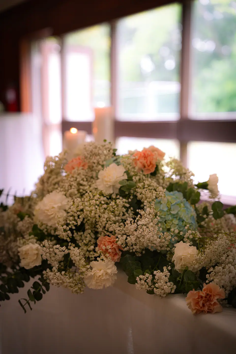 A pastel floral centrepiece in the reception room