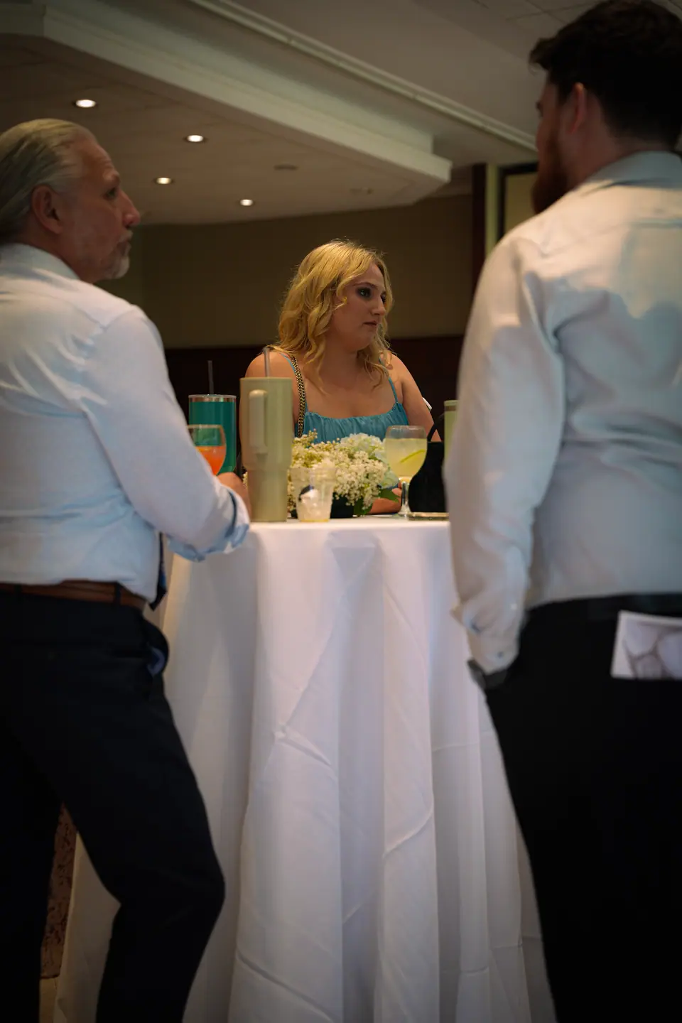 The bride greeting guests at a cocktail table